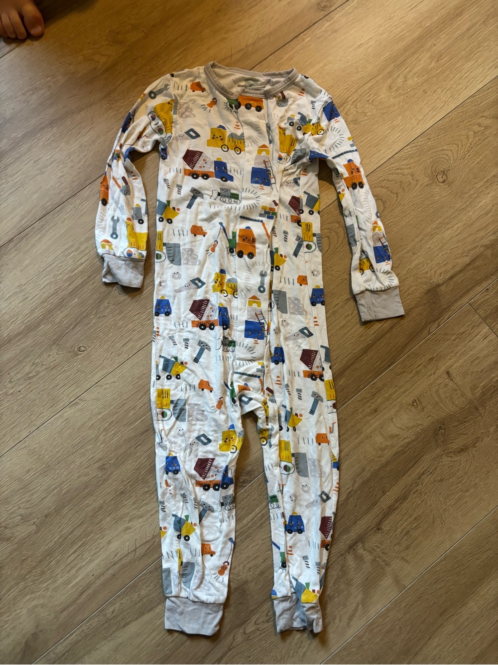 Magnetic Me White Footed One-Piece Pajamas with Yellow, Blue, Orange Truck Print